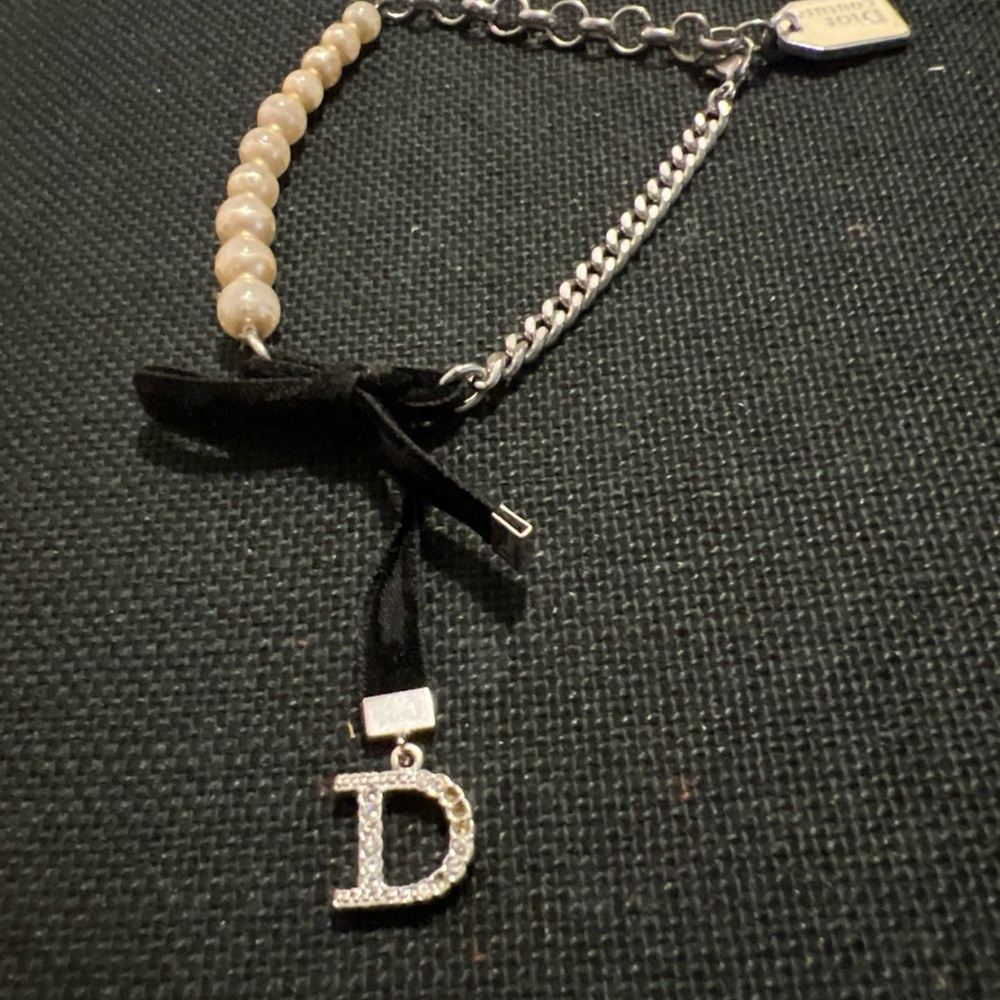 Dior Cream and Black Charm bracelet with Bow - Picture 1 of 7